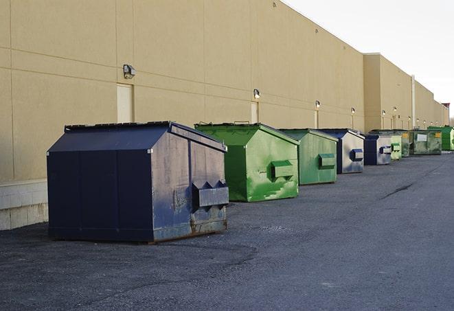 several large trash cans setup for proper construction site cleanup in Alamance, NC